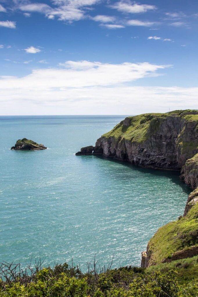 Scenic coastal cliffs overlooking the sea, representing innovation and stability.